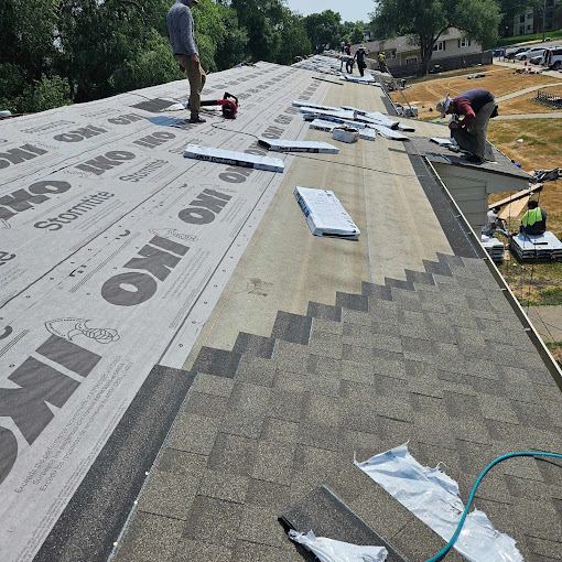 A couple of men working on a roof